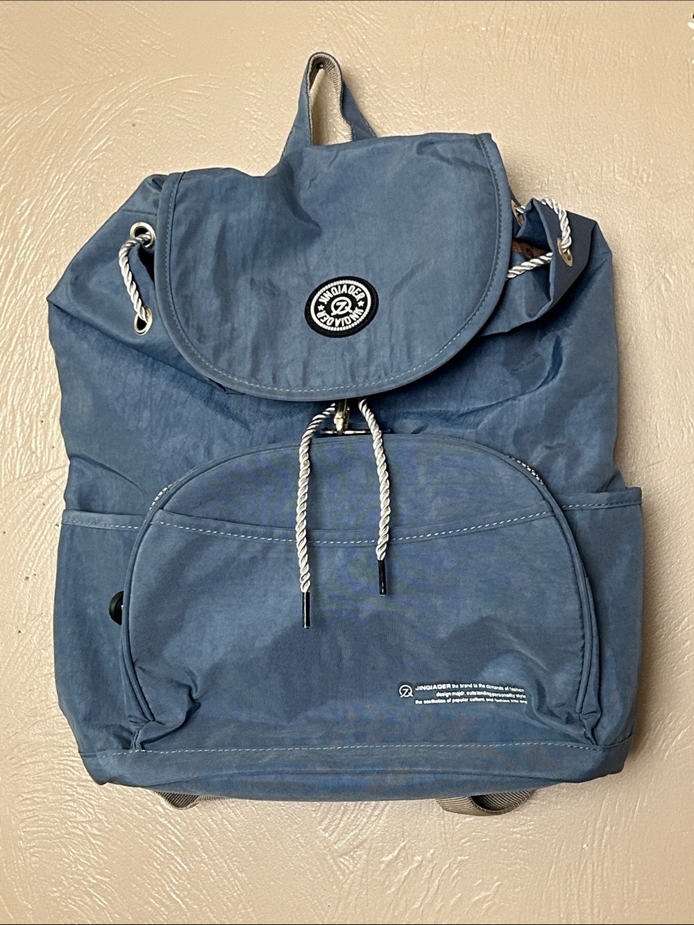 Jinqiaoer Lightweight Blue Nylon Drawstring Backpack. Adjustable Straps. Unisex.
